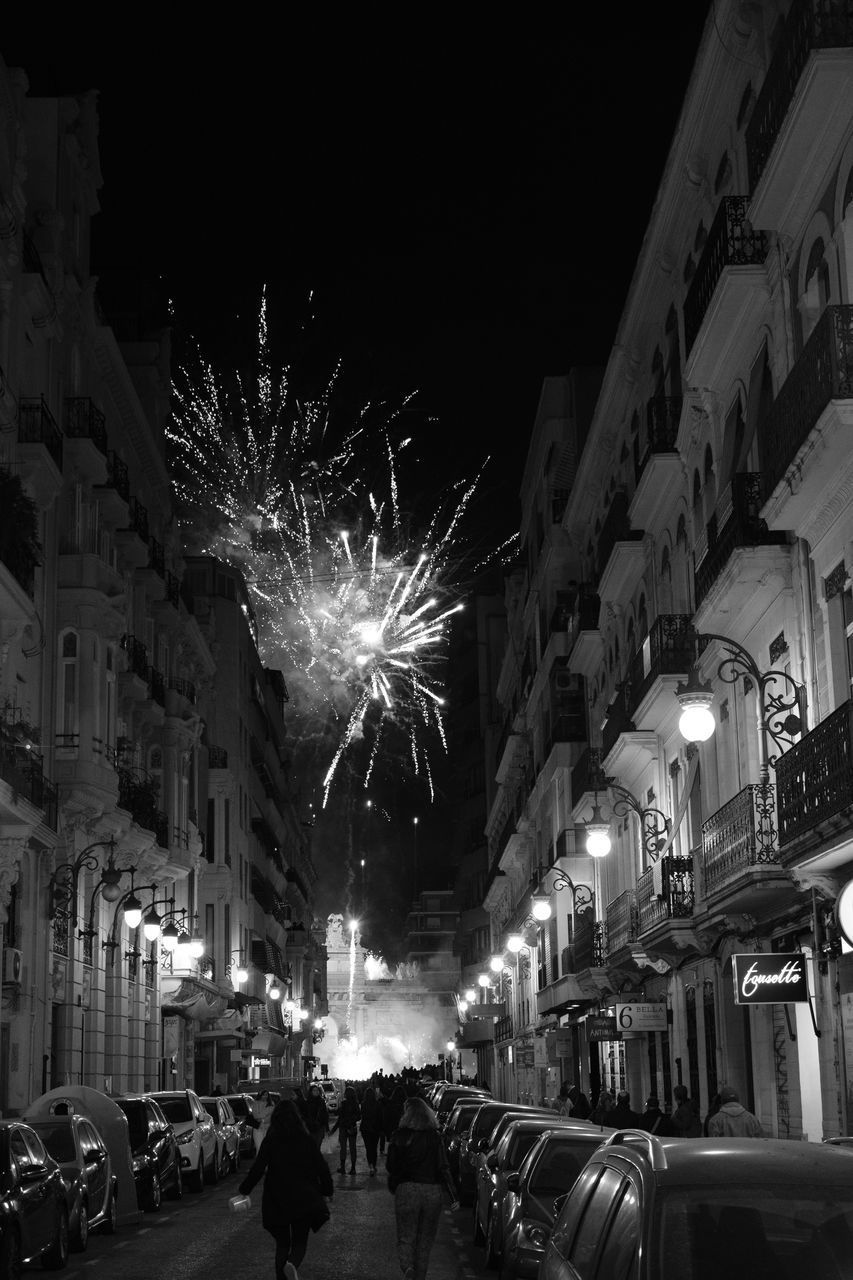 FIREWORK DISPLAY OVER CITY AT NIGHT