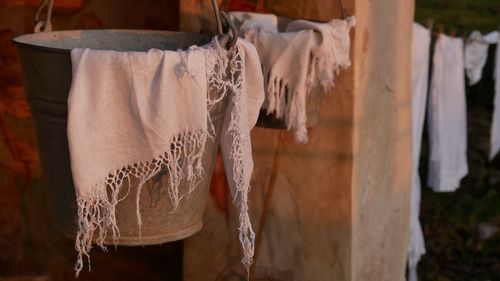 Close-up of clothes drying on rope