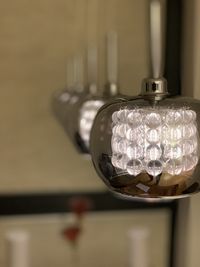 Close-up of illuminated light bulb at home