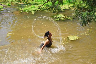 Water motion from hair of woman