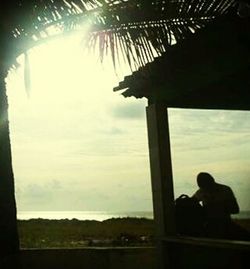 Couple sitting on sea