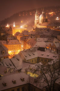 High angle view of illuminated buildings in city