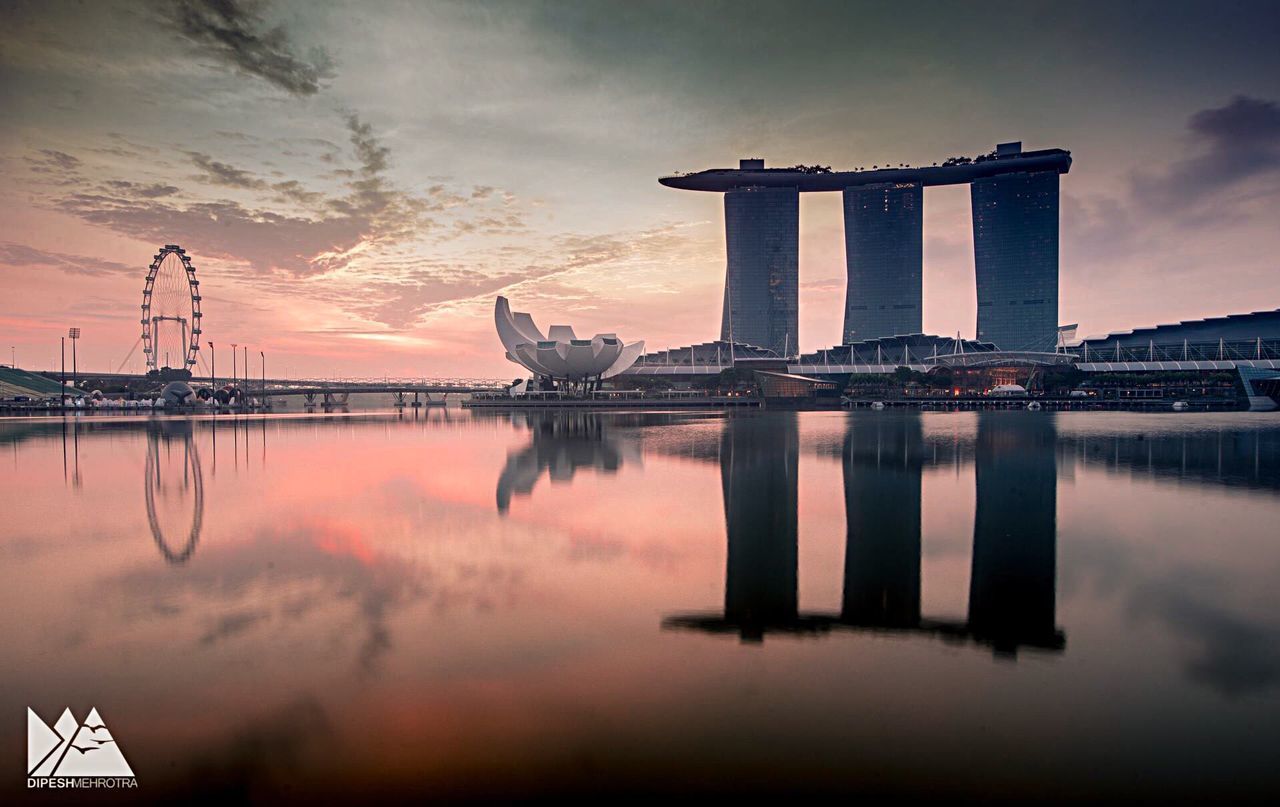 REFLECTION OF BUILDING IN SEA