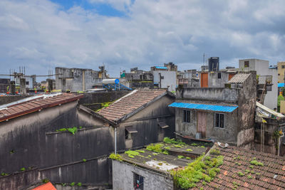 High angle view of buildings in town against sky