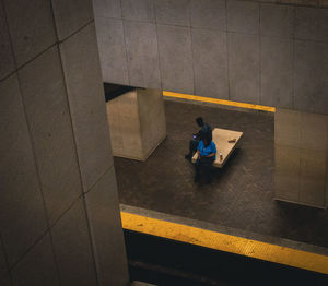 High angle view of man walking in city