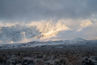 Scenic view of snowcapped mountains against sky