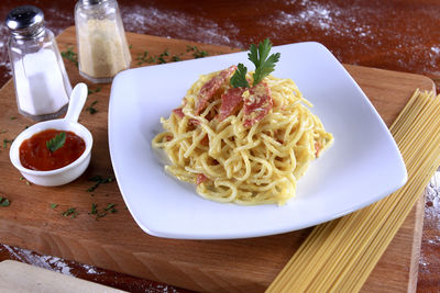 High angle view of pasta in plate on table