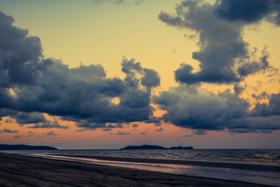 Scenic view of beach against sky during sunset