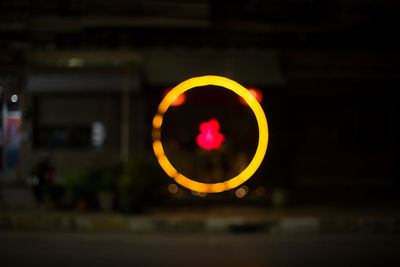 Close-up of illuminated lighting equipment at night