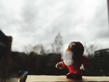 Close-up of stuffed toy against sky