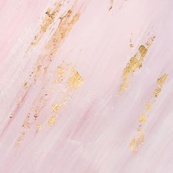 Delicate pink marble background with gold brushstrokes. place for your design.