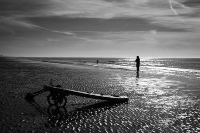 Man on beach against sky