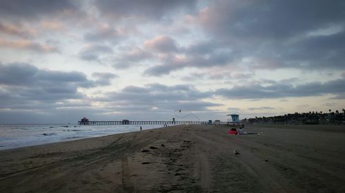 Scenic view of beach against sky during sunset