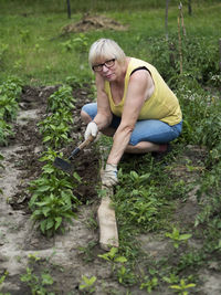 Full length of woman wearing mask on field