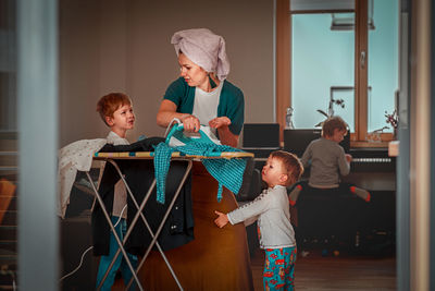 Cute kids with mother at home