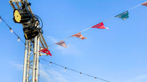 Low angle view of street light against clear blue sky