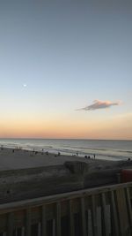 Scenic view of sea against clear sky during sunset