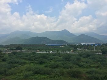 Scenic view of landscape and mountains against sky