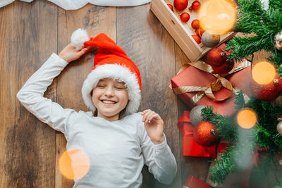 Portrait of cute girl decorating christmas tree