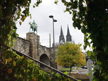 Historic temple against sky in city