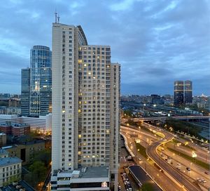 High angle view of buildings in city against sky