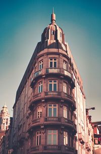 Low angle view of building against blue sky