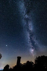 Milkyway above old castle tower silhouette