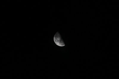 Low angle view of moon against sky at night