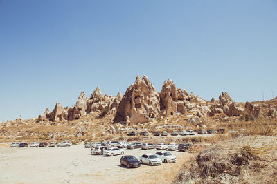 Panoramic view of rock formations against clear sky