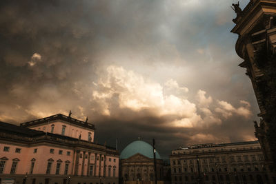 Low angle view of buildings against sky during sunset