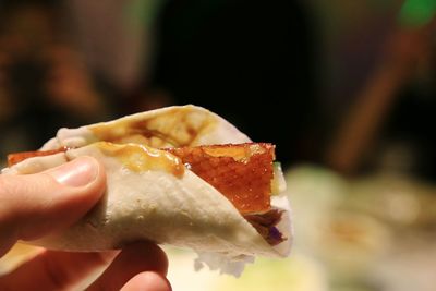 Cropped hand holding ice cream cone