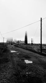 View of road along buildings