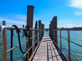 Pier over sea against sky