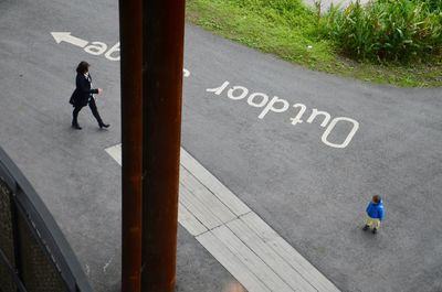 Man with umbrella on road