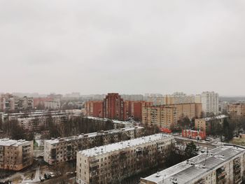 High angle view of buildings in city against sky