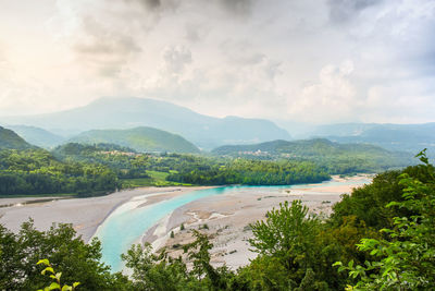 Aerial view of landscape against cloudy sky