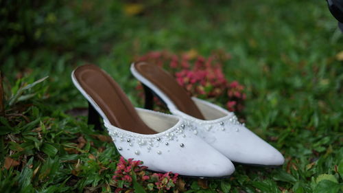 Close-up of shoes on grass