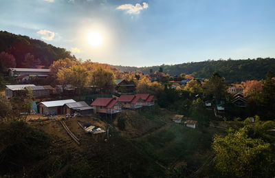 High angle view of houses and buildings against sky