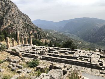 Ruins of building against mountain range