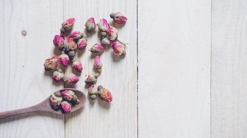 High angle view of pink roses on table