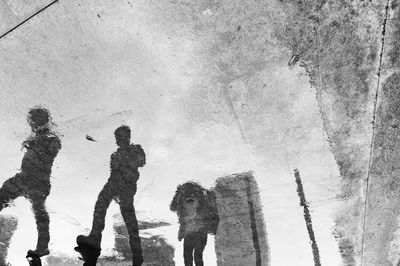 Panoramic shot of people standing on snow covered landscape