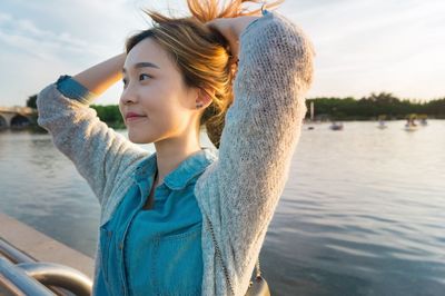 Portrait of young woman in lake