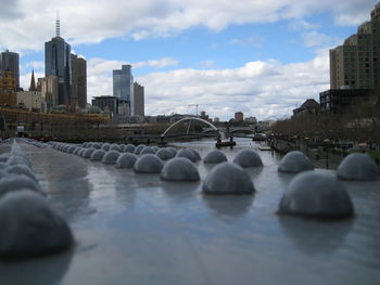View of bridge over river in city