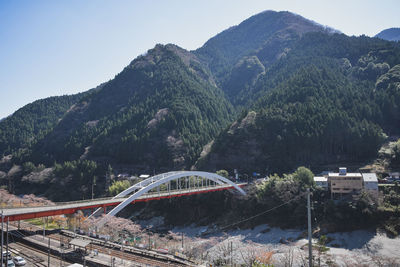 High angle view of bridge over mountains against sky