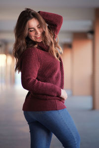 Portrait of a smiling young woman standing outdoors