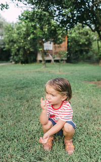 Cute baby girl on land