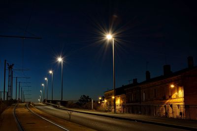 Illuminated street lights at night