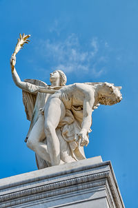 Low angle view of statue against sky