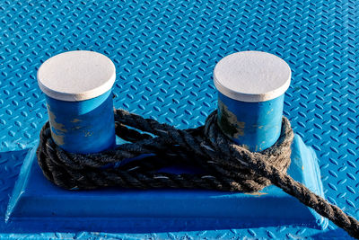 High angle view of ropes on blue table