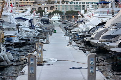 Yachts moored at harbor